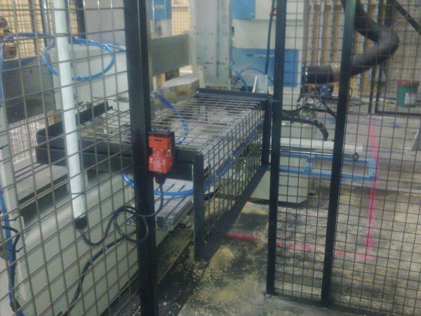 Machinery guarding fabricated and installed in a factory